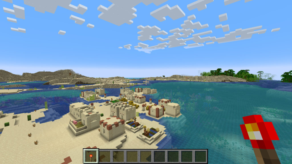 Screenshot aus Minecraft: Sandige Insel mit Dorf