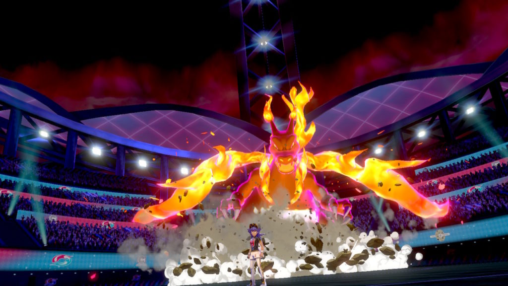 Champ Delion und Gigadynamax-Glurak in einer Pokémon Arena.